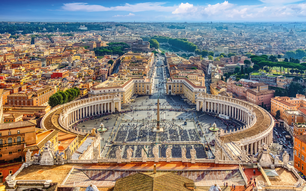 Famous Saint Peter's Square in Vatican and aerial view of the Ro