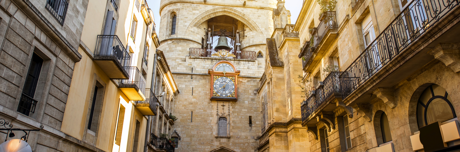 Stree view on the Big Clock of Bordeaux city during the morning light in France