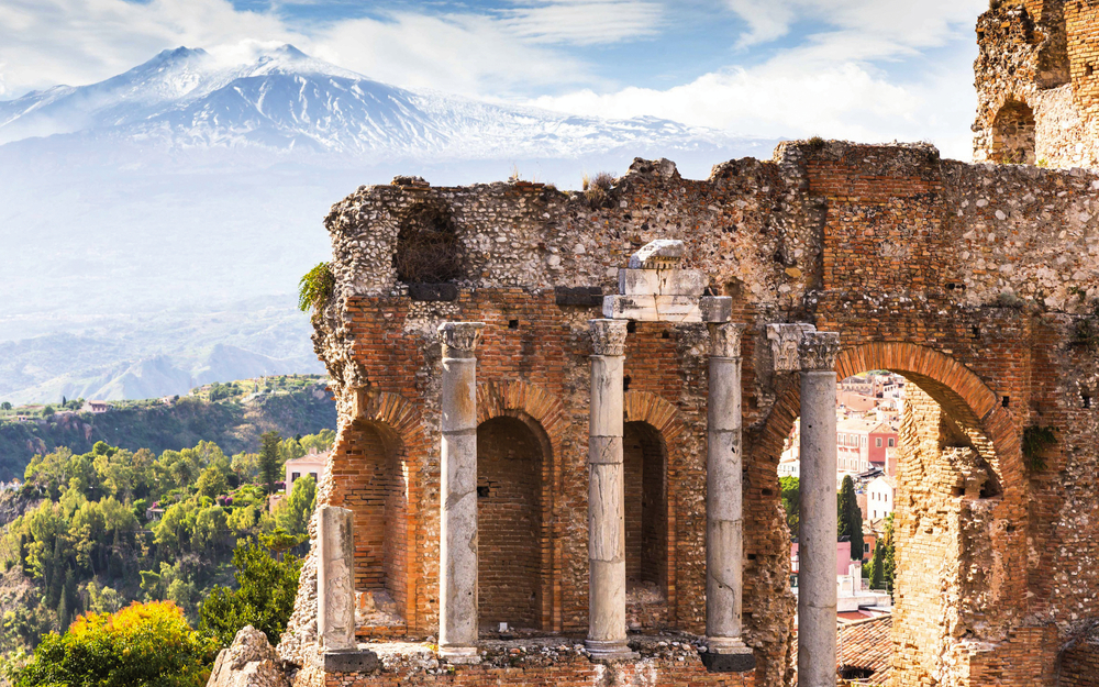 Ruins and columns of antique greek theater in Taormina and Etna 