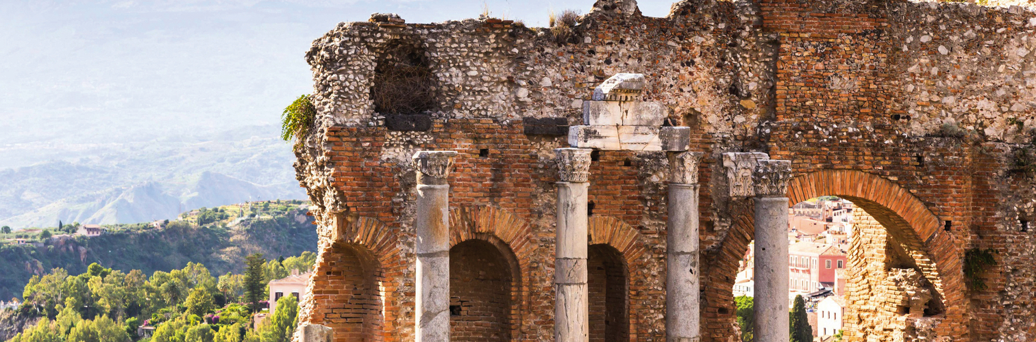 Ruins and columns of antique greek theater in Taormina and Etna 