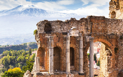 Ruins and columns of antique greek theater in Taormina and Etna 