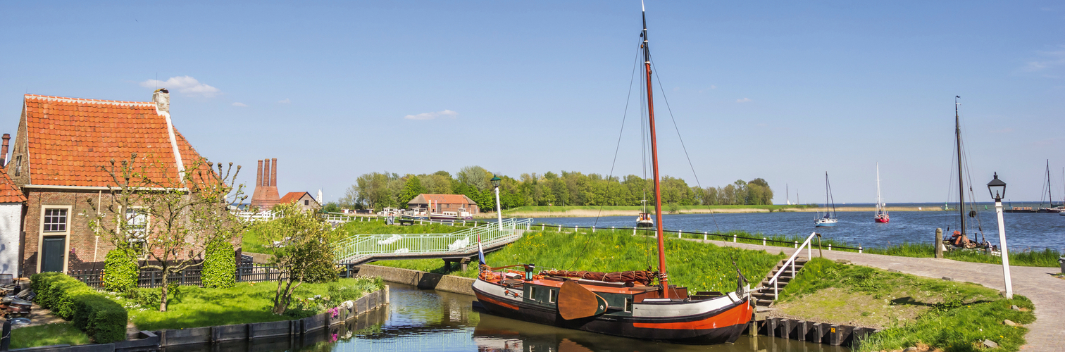 Panorama of a sailing ship at a dike in Enkhuizen
