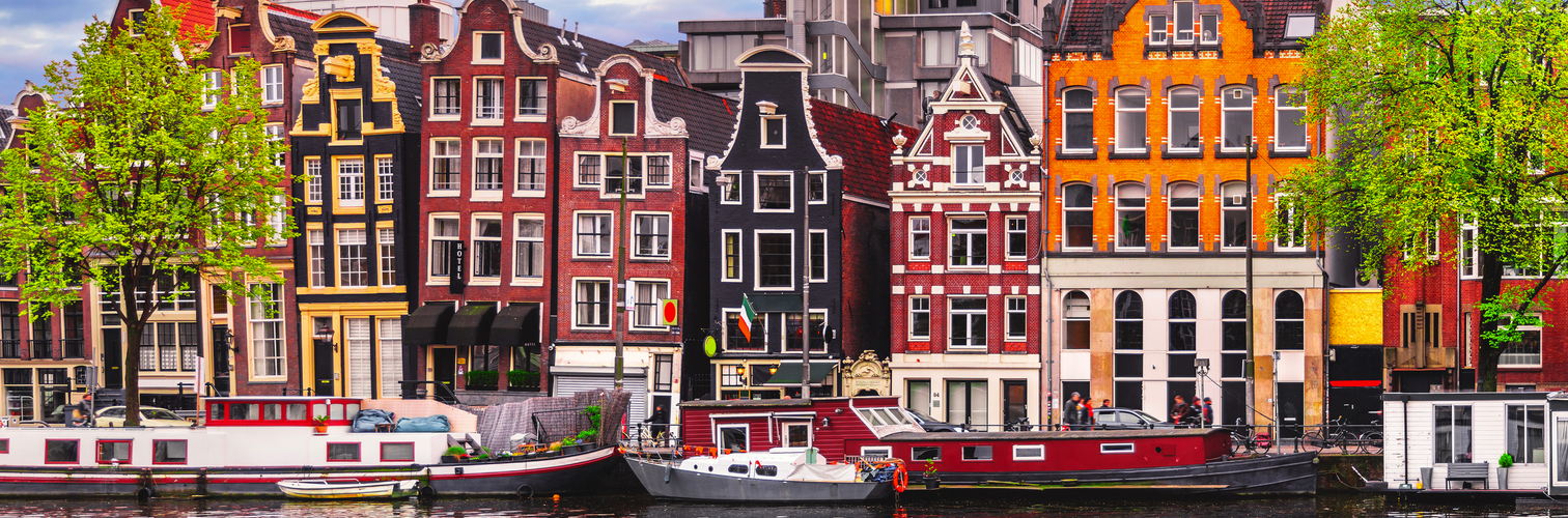 Amsterdam Netherlands dancing houses over river Amstel landmark