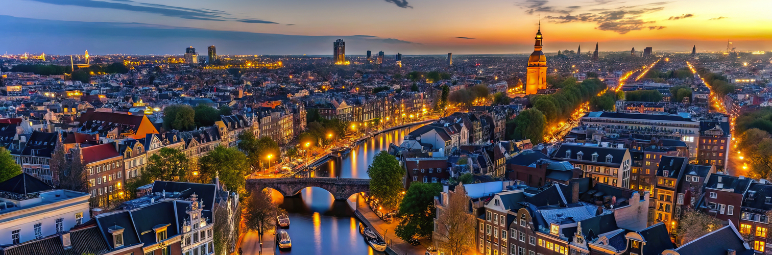 Aerial view of Amsterdam canals and old center district at night