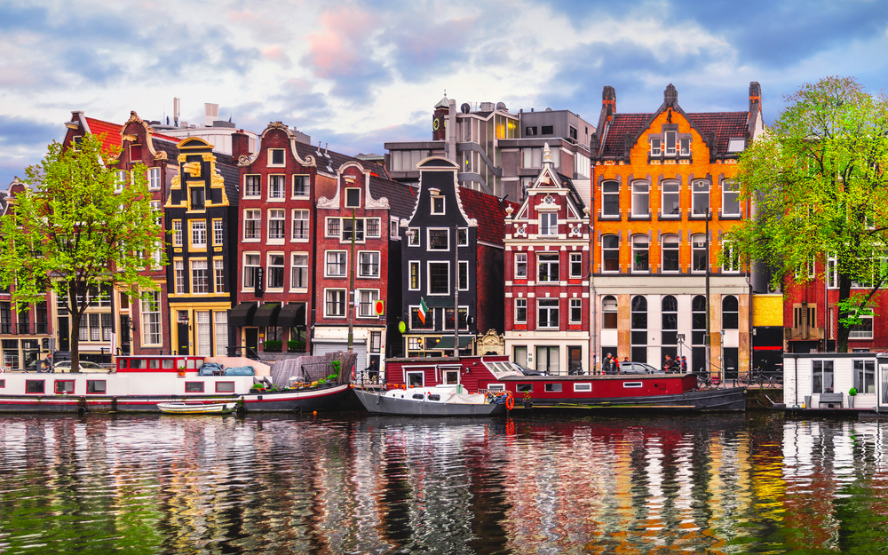 Amsterdam Netherlands dancing houses over river Amstel landmark