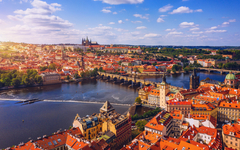 Prague scenic spring aerial view of the Prague Old Town pier architecture Charles Bridge over Vltava river in Prague, Czechia. Old Town of Prague with the Castle in the background, Czech Republic.