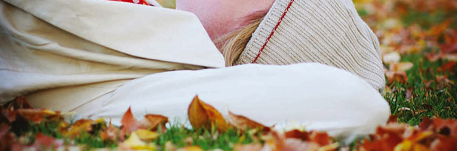 woman lying in leaves